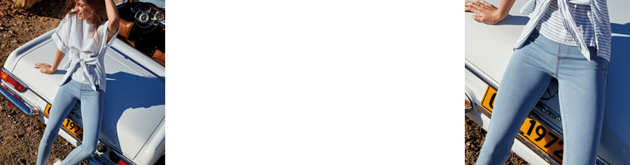 Woman wearing blue cropped jeans with striped top