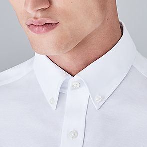 Man wearing button-down collar shirt