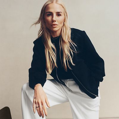 Alex Greenwood wearing bomber jacket and tailored trousers. Shop M&S x ENGLAND