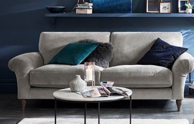 Comfortable grey sofa with cushions