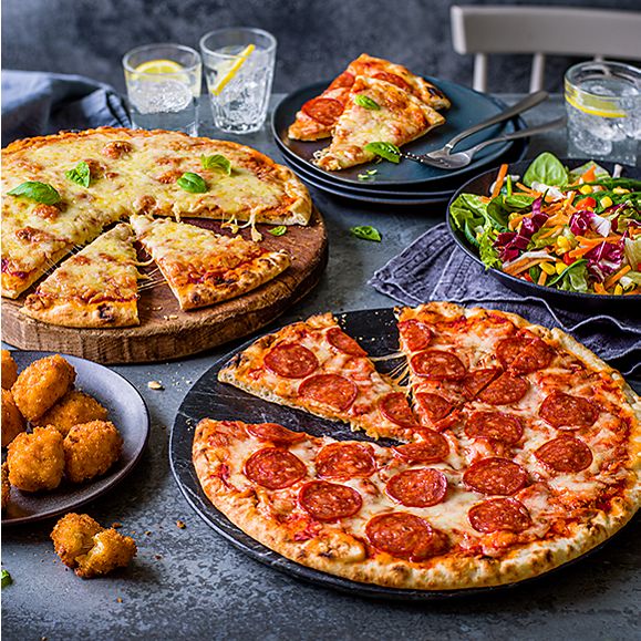 A selection of pizzas and sides