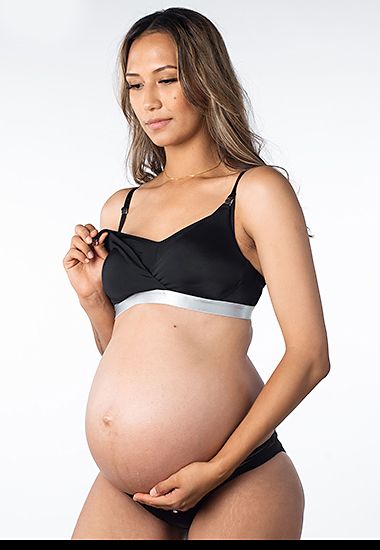 Woman wearing Hotmilk non-wired breast pump and nursing bra 