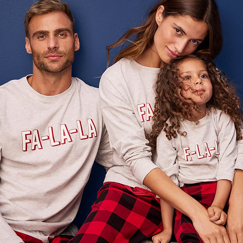 Family wearing matching pyjamas. Shop family Christmas pyjamas