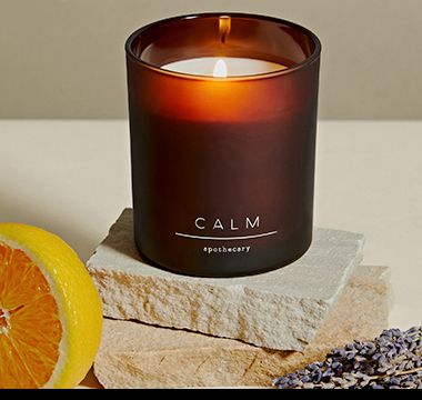 Apothecary Calm candle styled with orange segment, rocks and lavender. Shop now.