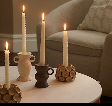Group of candles and candle holders. Shop candle holders