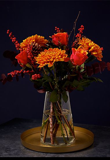 Bronze chrysanthemum bouquet in glass vase. Shop now 
