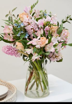 Scented hyacinth, tweedia and rose bouquet in vase. Shop nows