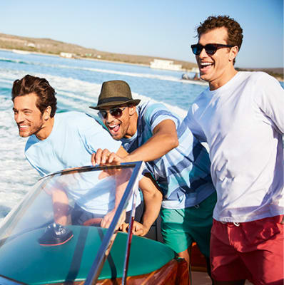 Man with child and baby on a beach