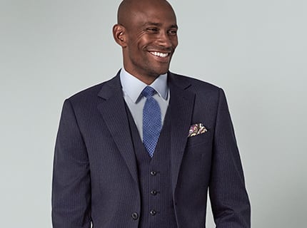 Man wearing pocket square in navy suit
