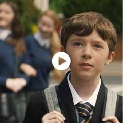 Boy wearing M&S school uniform