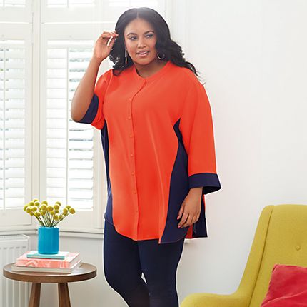 Model wearing a colour-block orange and navy blouse from the Curve collection