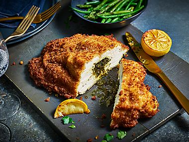 Our Best Ever chicken kiev sliced on a chopping board