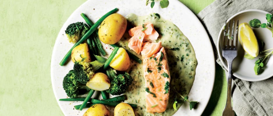 Salmon in a white sauce with new potatoes, green beans and broccoli 