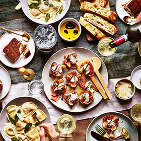 An Italian feast of pasta, fig salad, tiramisu and wine