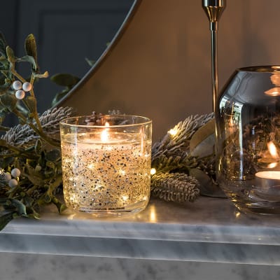 Light-up LED candle on mantelpiece