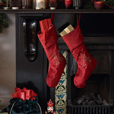 Christmas fireplace decorated with candles and stockings