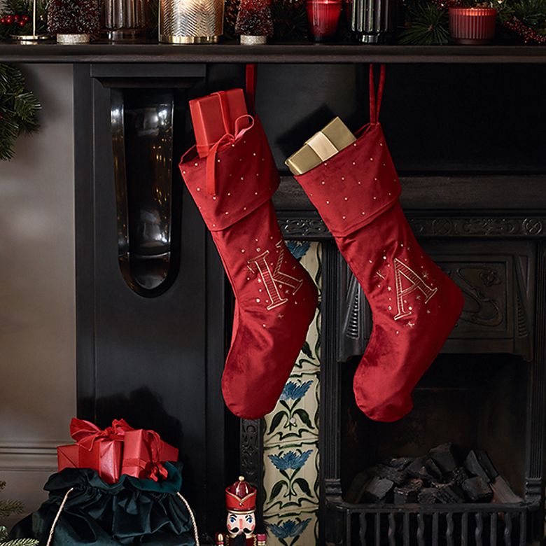 Christmas fireplace decorated with candles and stockings