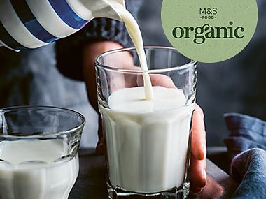 Organic milk being poured into a glass
