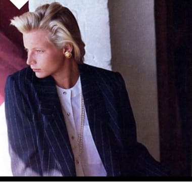 Woman wearing a masculine tailored skirt suit, 1987-88