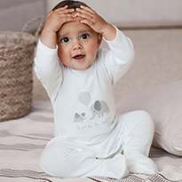 Baby wearing 'Born in 2020' sleepsuit