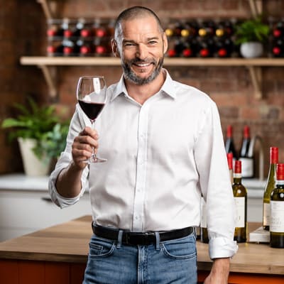 Fred Sirieix with a glass of red wine