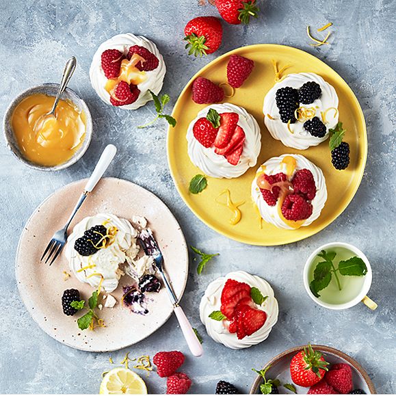 Mini pavlovas topped with berries