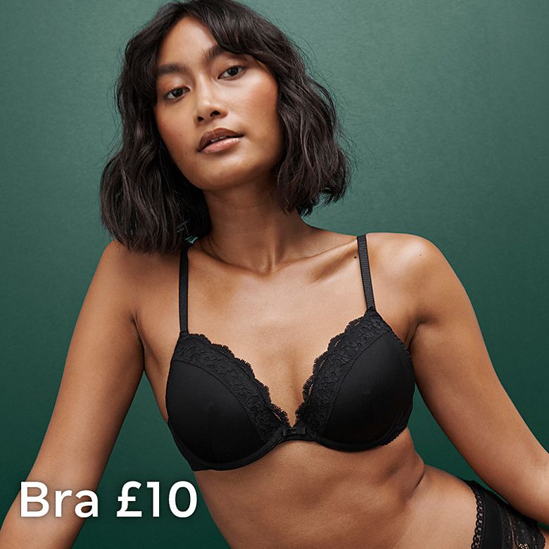 Woman wearing black bra and knickers. Shop the bra