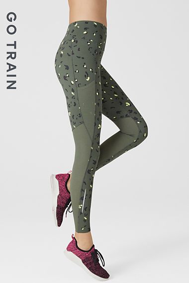 Woman wearing khaki printed leggings