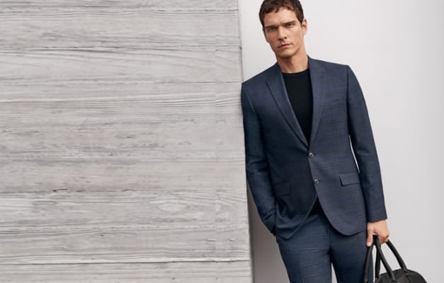 Man wearing slim blue checked suit