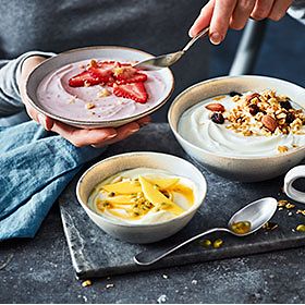 Yoghurts with fresh fruit and nut toppings