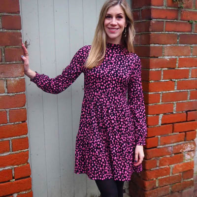 Woman wearing tiered floral dress and tights