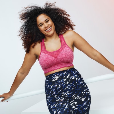 Woman wearing pink sports bra and printed leggings