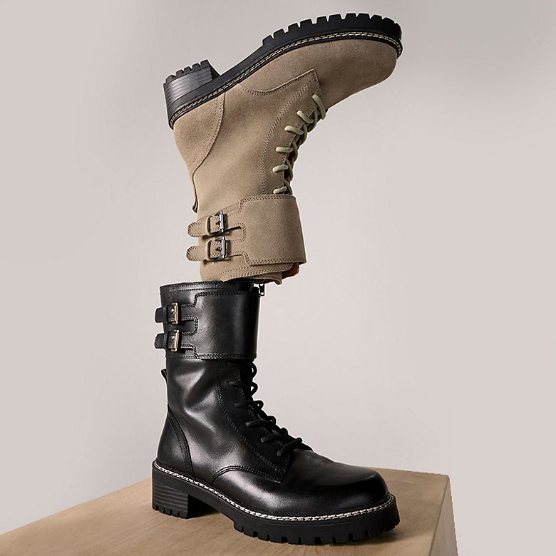 Two pairs of biker boots in black and grey. Shop boots