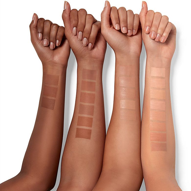 Four arms showing different shades of Clinique Superbalanced makeup. Shop all foundation. 