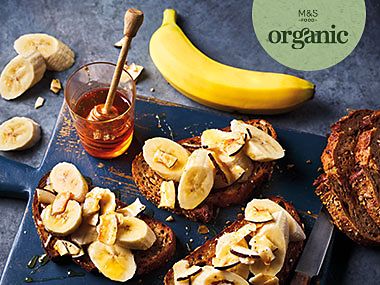 Organic bananas and sliced bananas in yoghurt