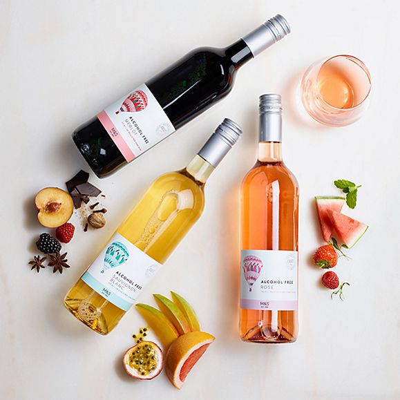 Bottles of red, white and rosé wine with fruit