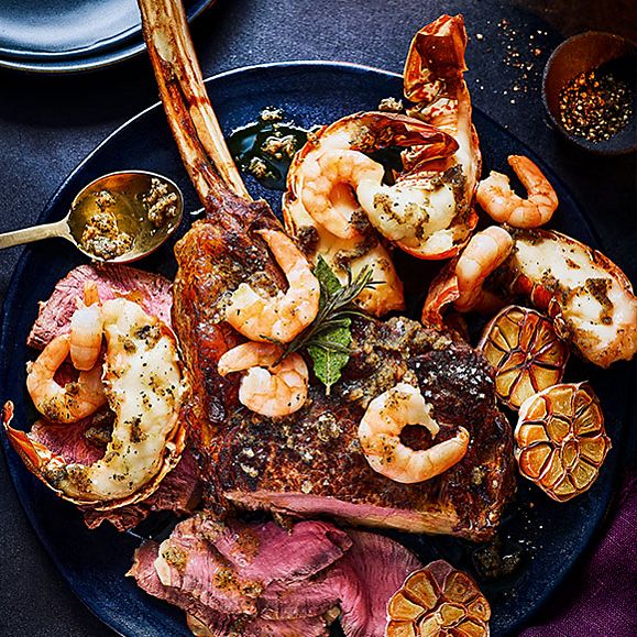 Collection surf and turf beef tomahawk with garlic butter