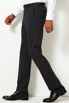 Man wearing grey slim-fit trousers