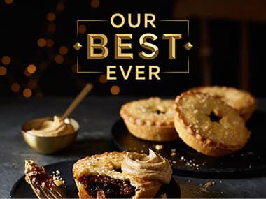 A plate of mince pies and a scoop of cream