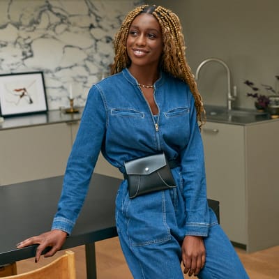 M S Insider Dominique wears long sleeved denim utility jumpsuit