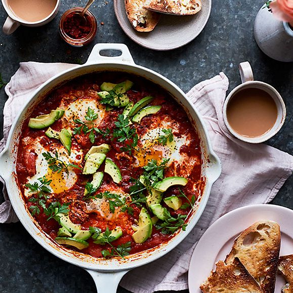 Pan of spicy baked eggs with sourdough toast