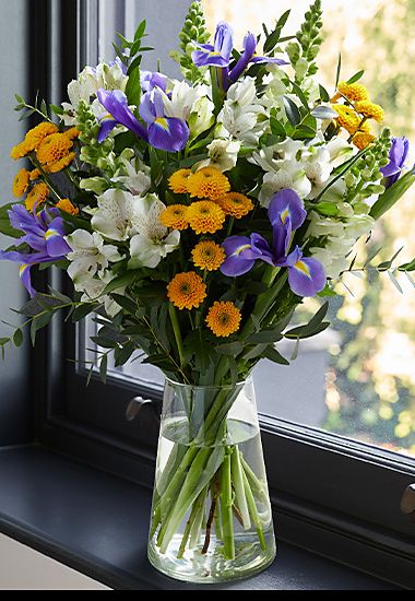 A vase filled with the ready-to-arrange March bouquet