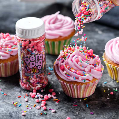 Cupcakes decorated with Percy buttercream and Percy Pig party sprinkles