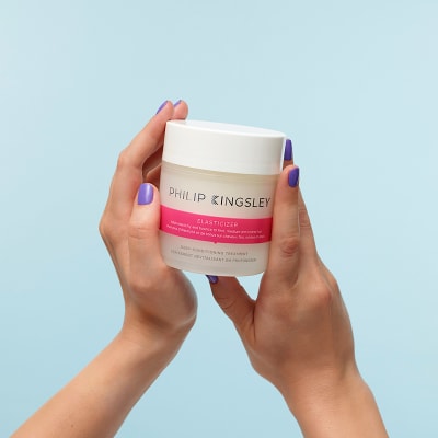 Hand holding Philip Kingsley Elasticizer