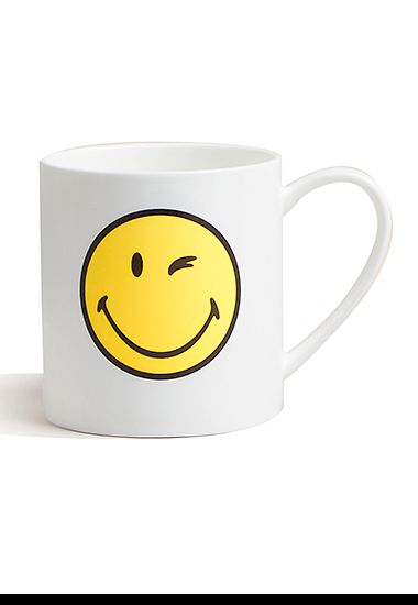 White mug with yellow smiley face