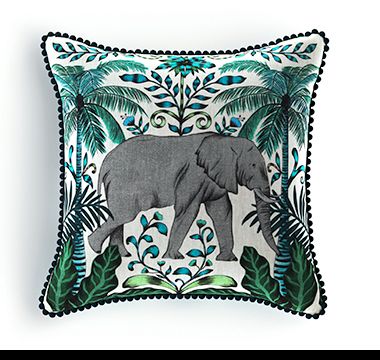 Green and white cushion with elephant design