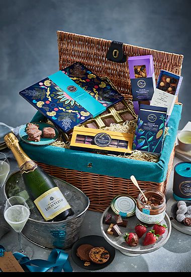 A hamper featuring Collection chocolates and champagne