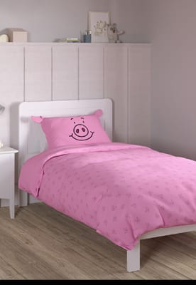 Percy Pig pink bedding set on a single bed. Shop now 