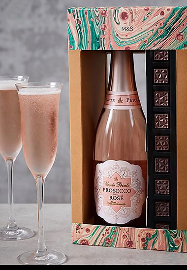 Bottle of rosé prosecco and chocolates. Shop alcohol gifts