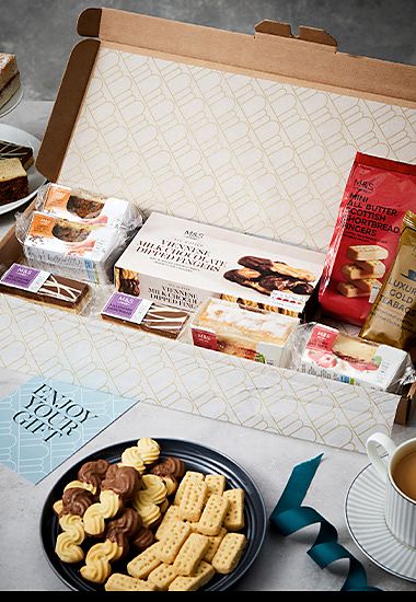 Selection of biscuits and tea in a gift box. Shop Mother’s Day food and drink gifts. 